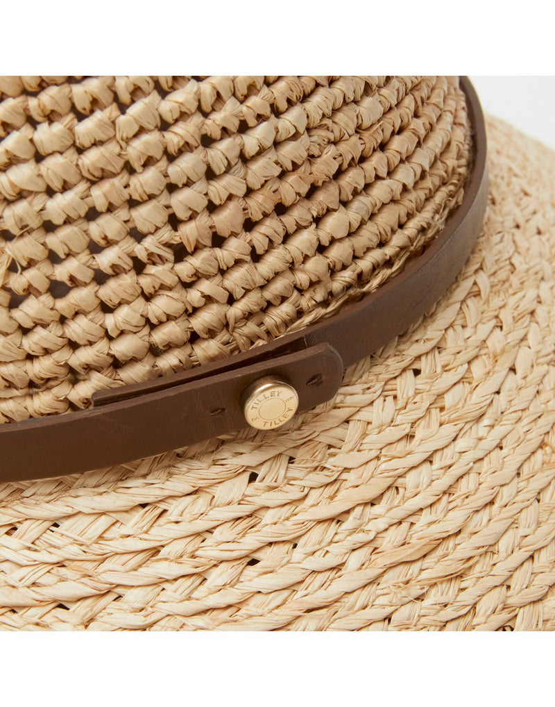 Close up of adjustable brown leather band around base of crown of Tilley Raffia Sun Hat