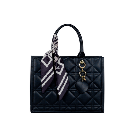 Black Sayan Top Zip Handbag Tote with patterned scarf and gold keychain accessories.