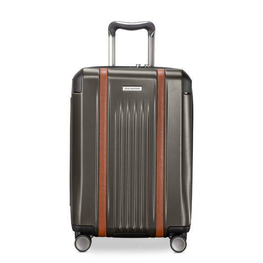 Product Image – Ricardo Beverly Hills Montecito 2.0 graphite gray carry-on with brown accents, spinner wheels, and TSA lock.