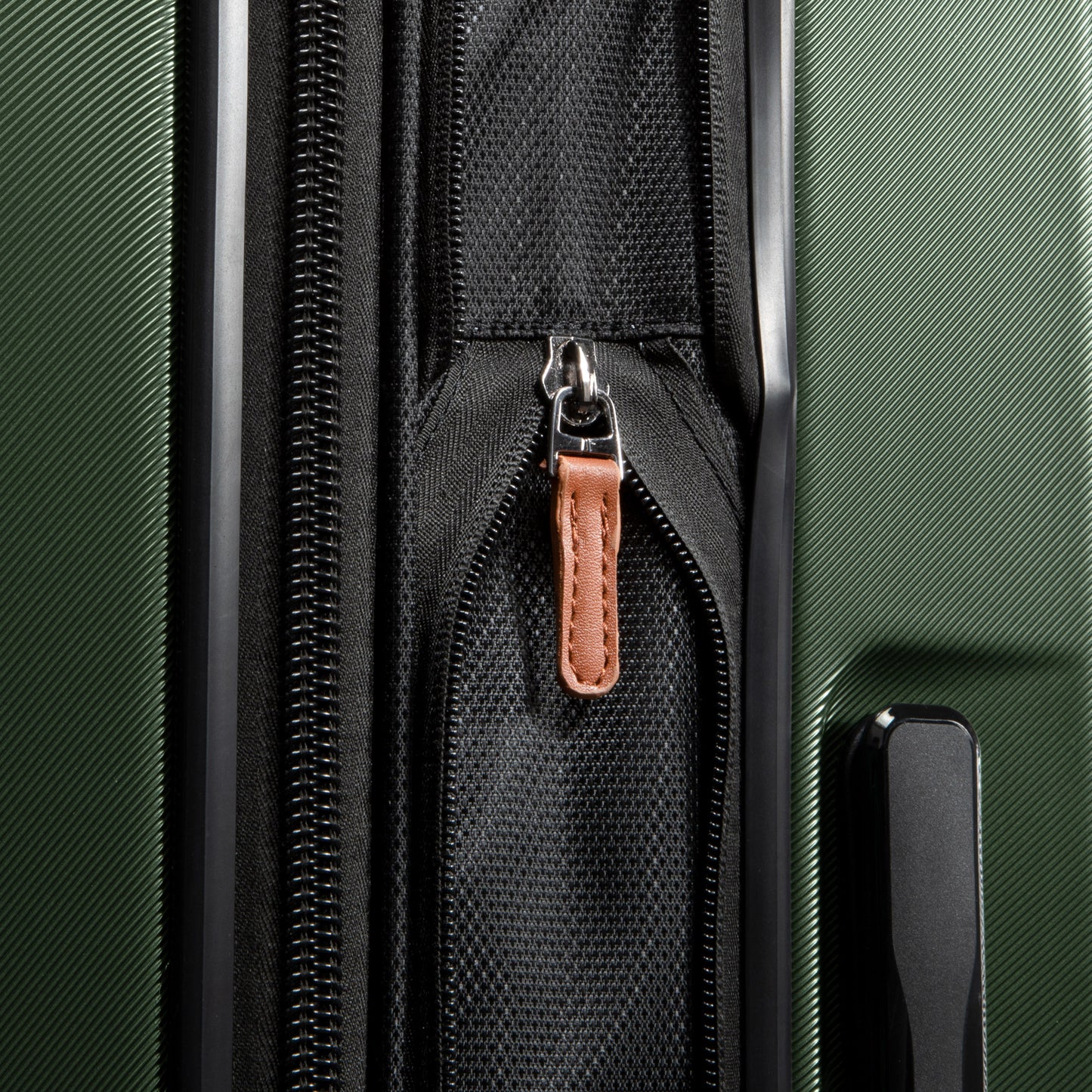 Green Ricardo Beverly Hills Montecito 2.0 21" Hardside Expandable Spinner Carry-on, features black zipper & brown leather pull.