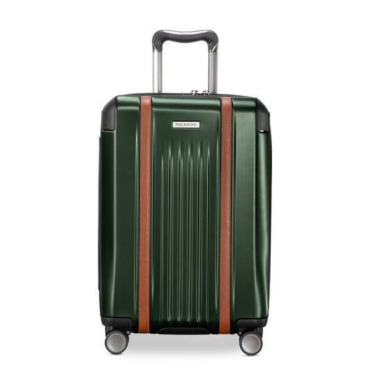 Product Image – Ricardo Beverly Hills Montecito 2.0 21" green hardside carry-on with TSA lock, brown accents, spinner wheels; ideal for travel.