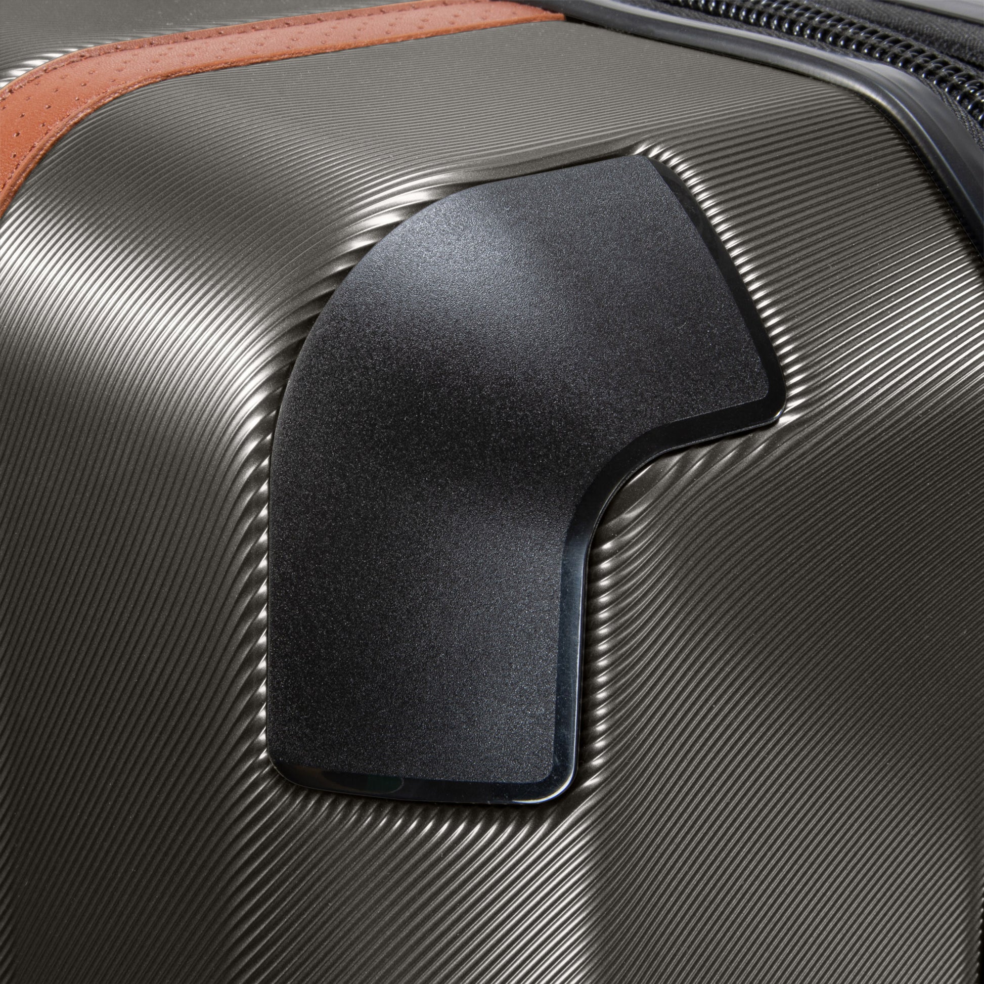 Close-up of Ricardo Beverly Hills Montecito 2.0 suitcase with textured gray surface, guard, and TSA-approved lock.