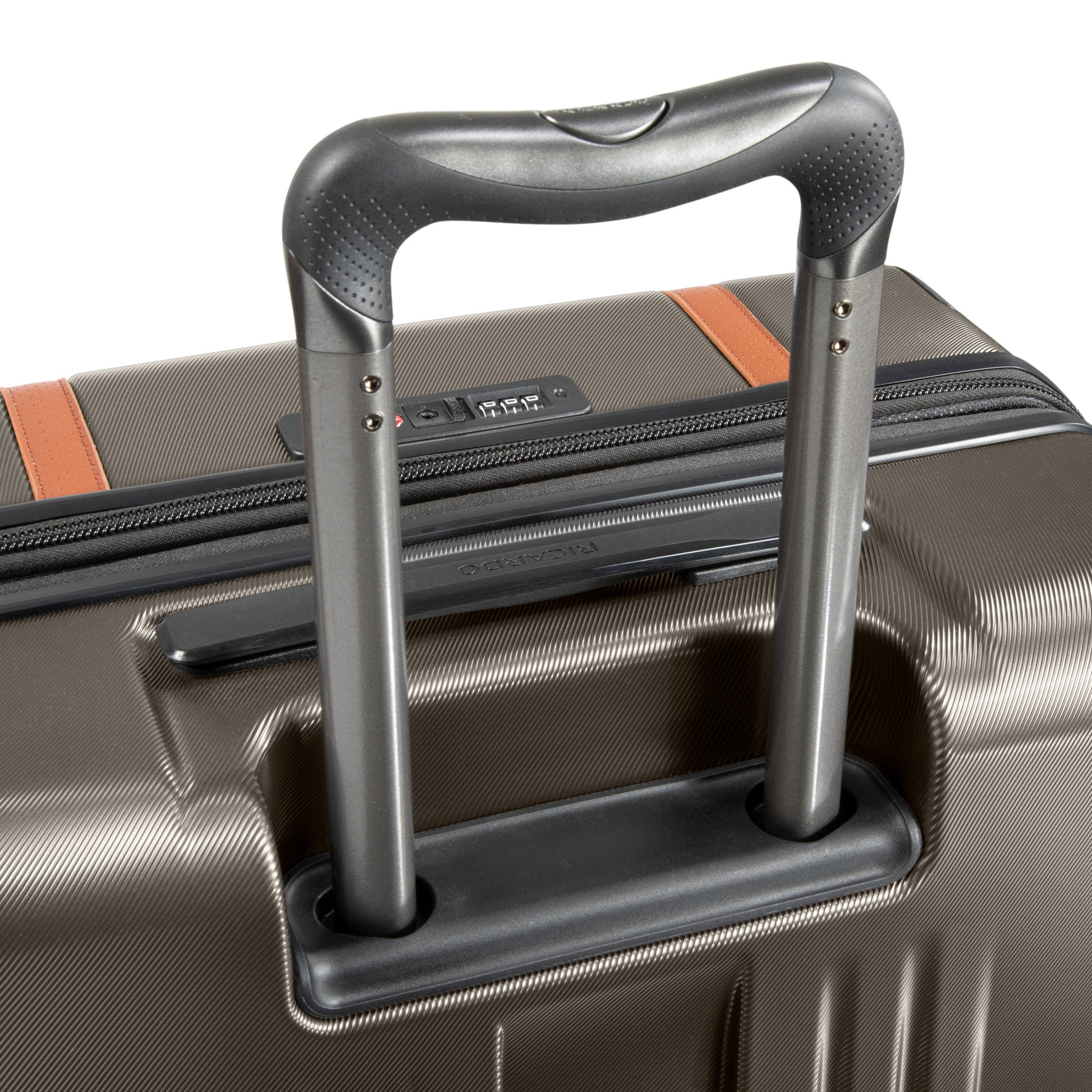 Close-up of the Ricardo Beverly Hills Montecito 2.0 black-accented brown suitcase handle online exclusive.