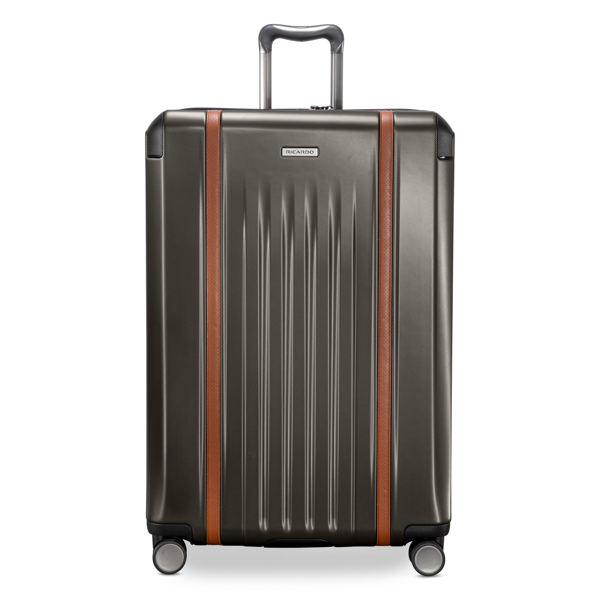 Ricardo Beverly Hills Montecito 2.0 29" graphite gray hardside suitcase with brown accents and silver wheels.