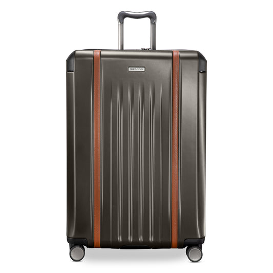 Product Image – Ricardo Beverly Hills Montecito 2.0 29" graphite gray hardside suitcase with brown accents and silver wheels.