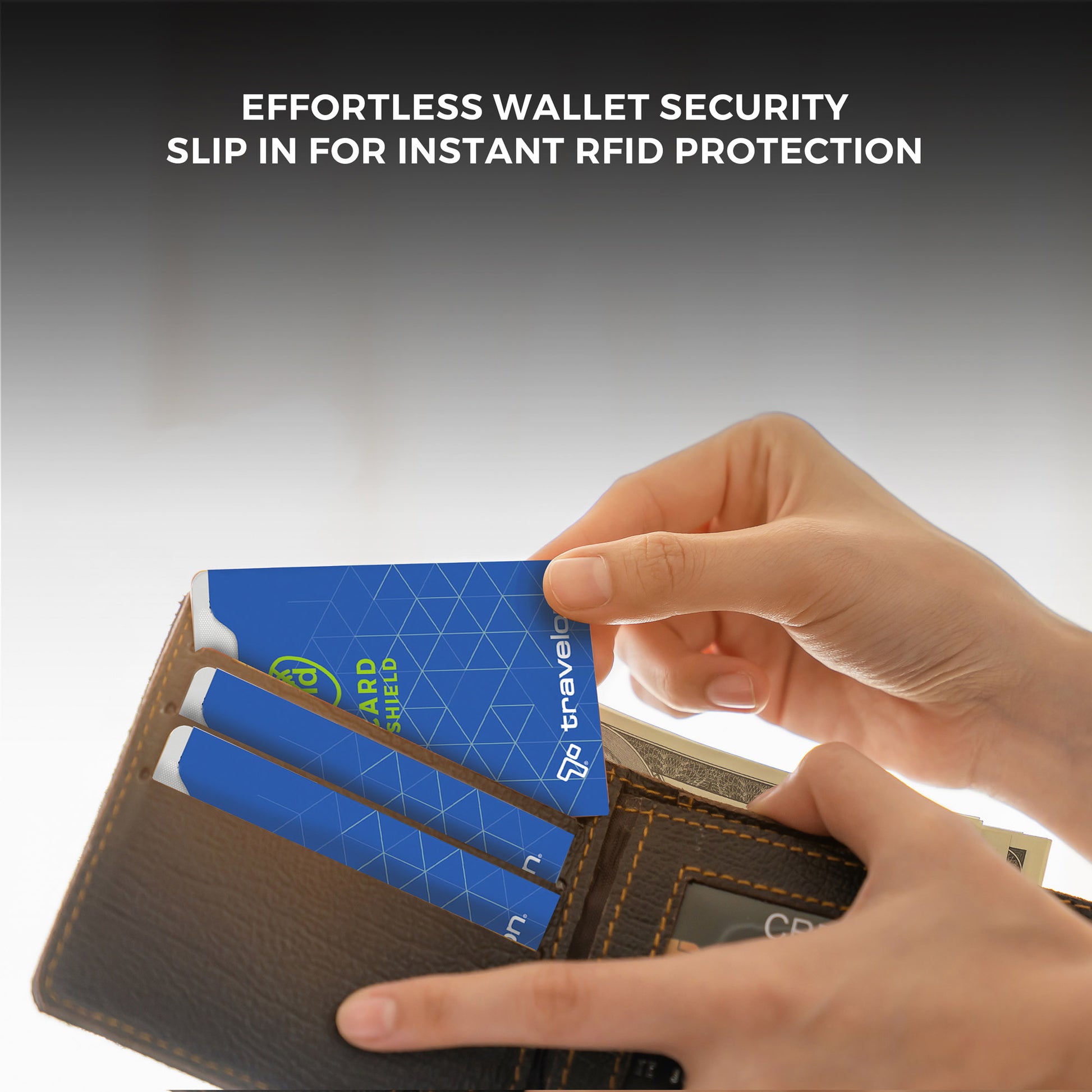 Hands inserting Travelon RFID Blocking Card Sleeves into a wallet for secure ID theft protection with cash and cards.