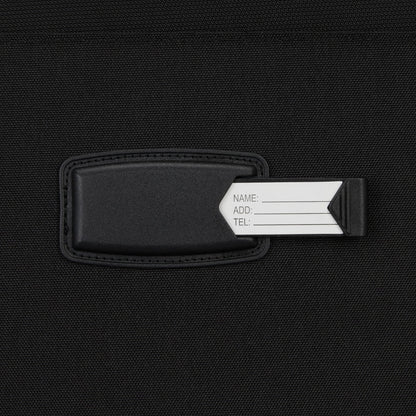 Close-up of a black luggage tag with ID card—ideal for organizing your High Sierra Pendall Carry-on Wheeled Duffle.