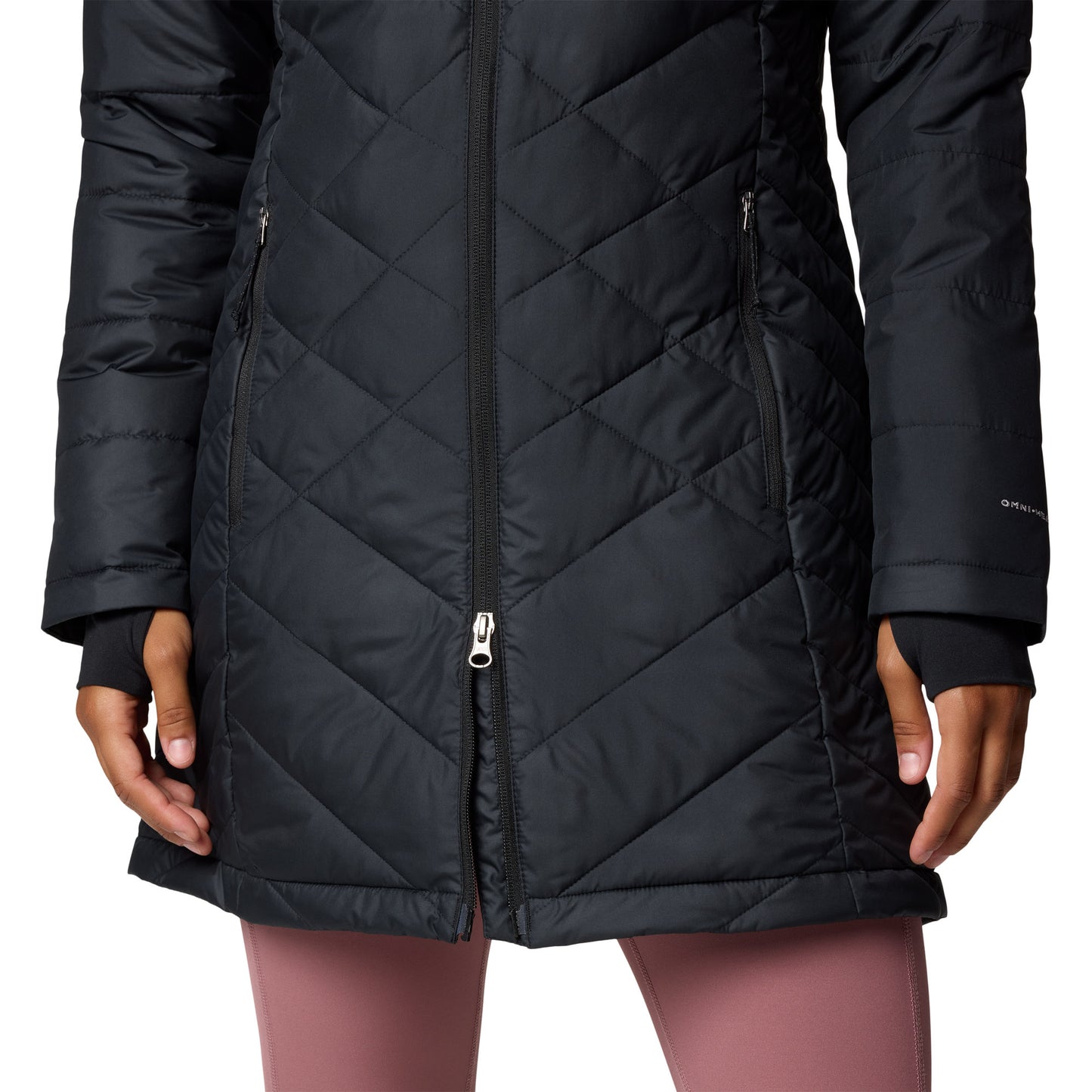 Bottom half of woman wearing Columbia Women's Heavenly™ Long Hooded Jacket in black, with two-way zipper partially unzipped from the bottom up