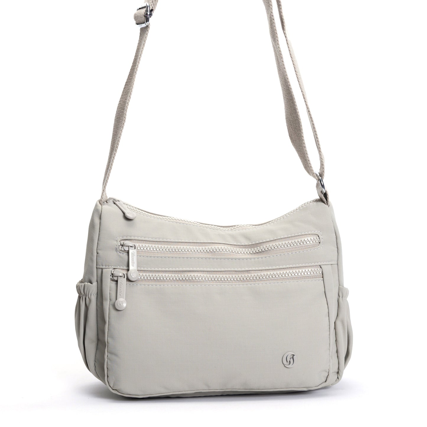 Miss Caprice Multi-zip Crossbody: cream bag with front zips & adjustable strap, ideal for travel.
