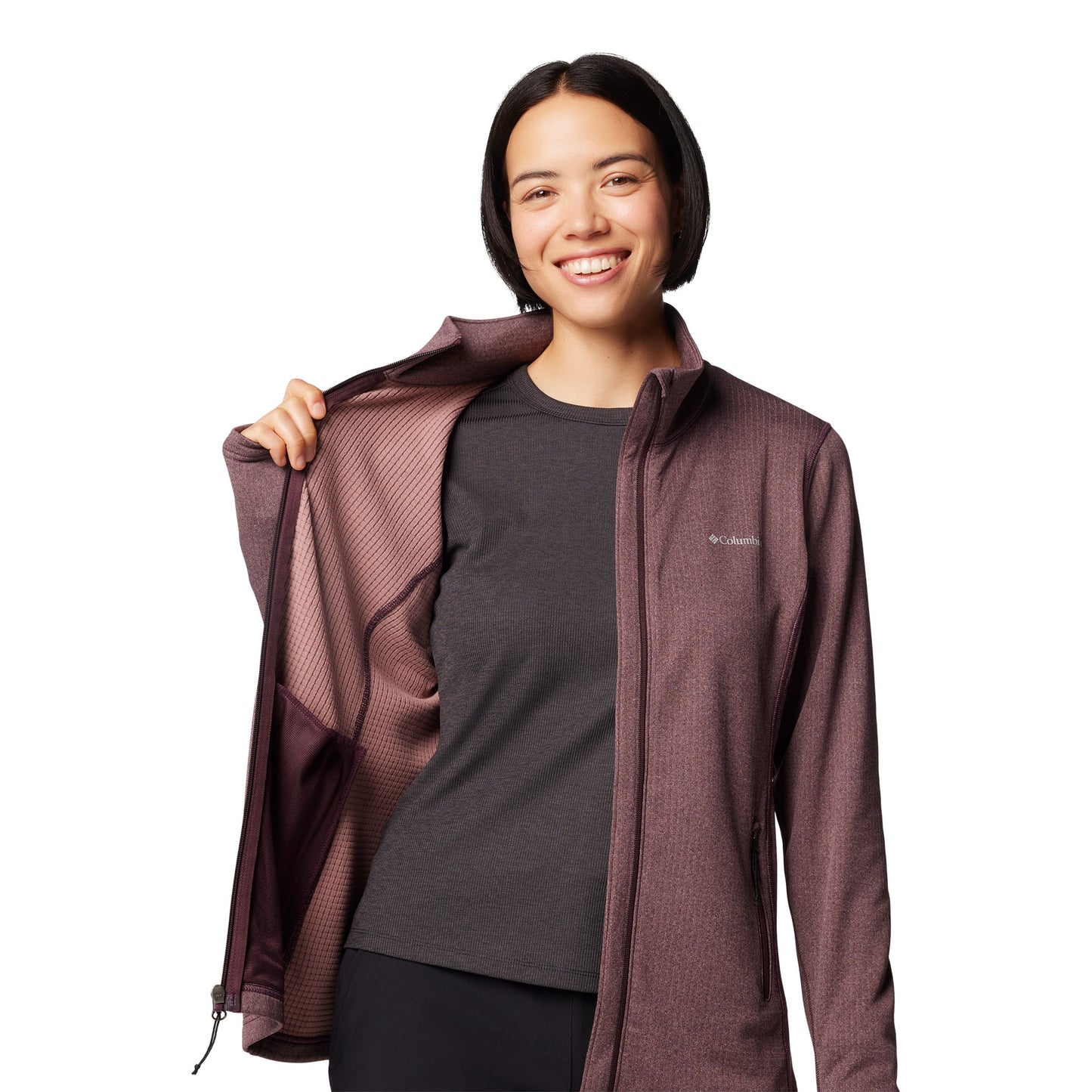 Top half of woman wearing Columbia Women's Park View™ Grid Full Zip Fleece Jacket in moonvista purple colour, front view, unzipped, holding one side open to show interior