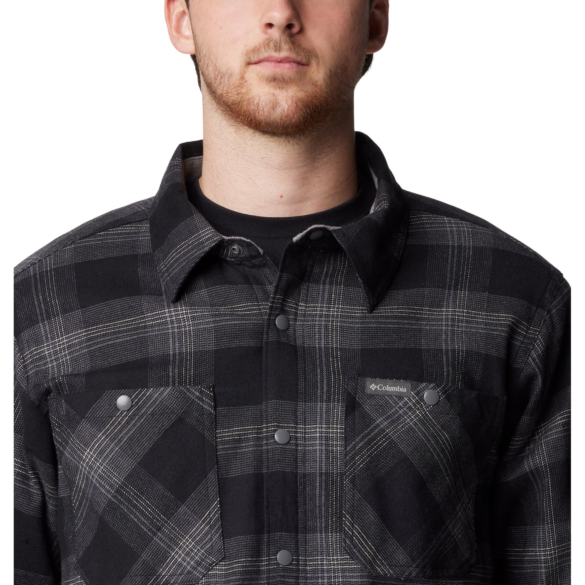 Top half of man wearing Columbia Men's Cornell Woods™ Fleece Lined Shirt Jacket in black buffalo tartan, buttoned up