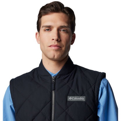 Top half of man wearing Columbia Men's Rad Padded™ Vest in black, front view, zipped up