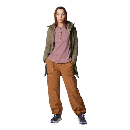 Woman wearing Columbia Women's Brea Falls™ Henley Long Sleeve Shirt in fig, with orange pants and a green jacket on top