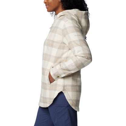 Woman wearing Columbia Women's Holly Hideaway™ Warm Lined Flannel Shirt Jacket in chalk buffalo tartan, side view with hands in pockets