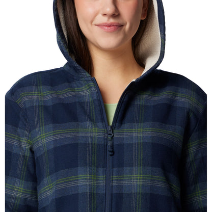 Top half of woman wearing Columbia Women's Holly Hideaway™ Warm Lined Flannel Shirt Jacket in collegiate navy, front view, zipped up and with hood up