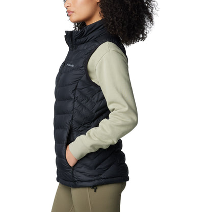 Woman wearing Columbia Women's Powder Lite™ II Vest in black, side view with hands in pockets