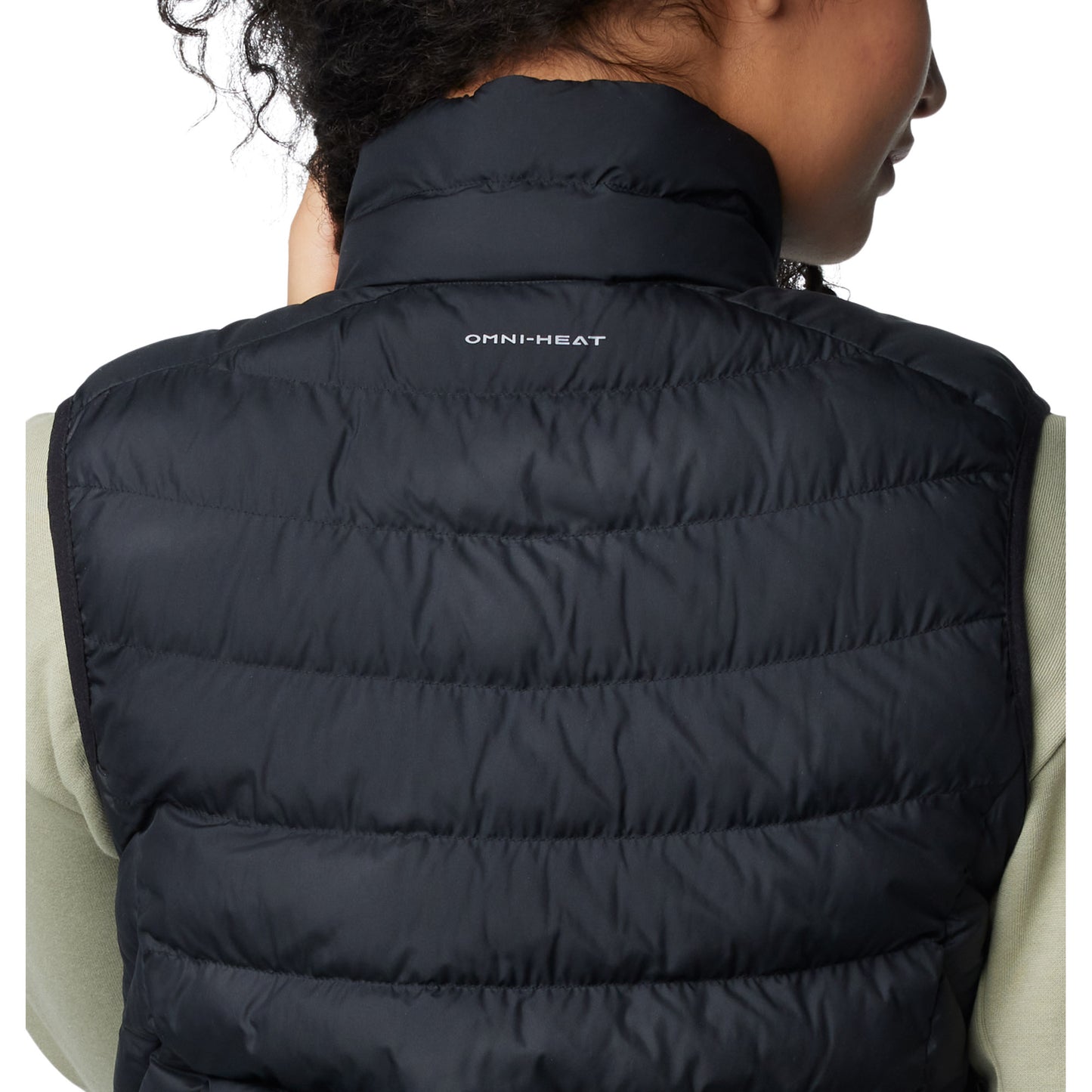 Top back half of woman wearing Columbia Women's Powder Lite™ II Vest in black