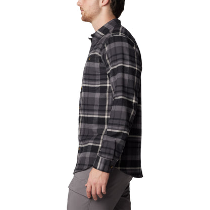 Man wearing Columbia Men's Pitchstone™ Heavyweight Flannel II in black multi plaid, black, grey, and white colour, side view