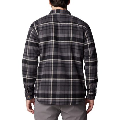 Man wearing Columbia Men's Pitchstone™ Heavyweight Flannel II in black multi plaid, black, grey, and white colour, back view