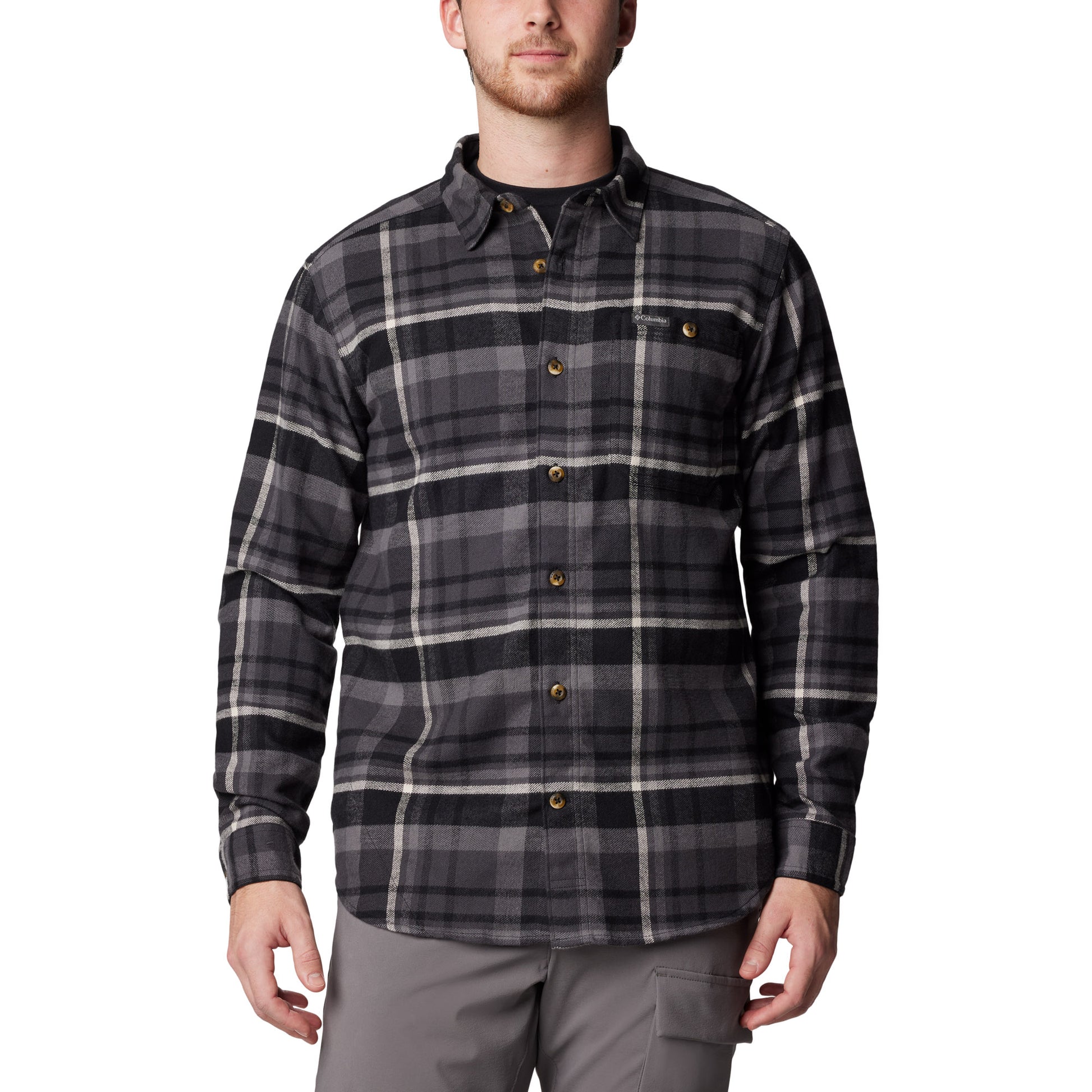 Man wearing Columbia Men's Pitchstone™ Heavyweight Flannel II in black multi plaid, black, grey, and white colour, front view, buttoned