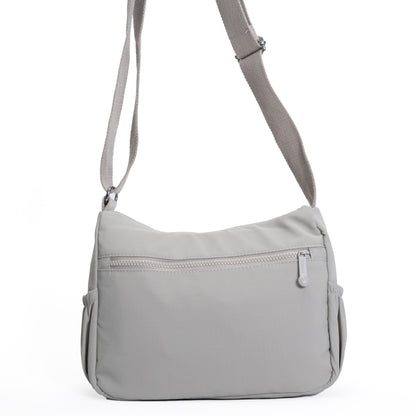 Miss Caprice Multi-zip Crossbody: a stylish women's large capacity bag with front zipper and adjustable strap.