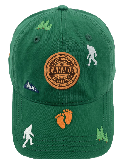 Northern Icons Canada Mountain Yeti Embroidered Cap in green with Canada patch on front and embroidered yetis, footprints, trees and mountains all over.