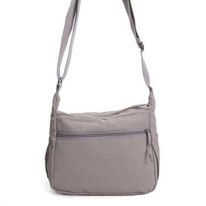 Miss Caprice Multi-zip Small Hobo Crossbody: cream, adjustable strap, front zipper—great for travel.