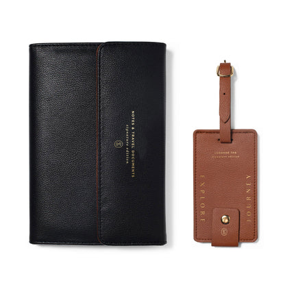 Fringe Jet Setter Travel Folio Set with a black travel folio and brown leather “Explore” and “Journey” luggage tags.