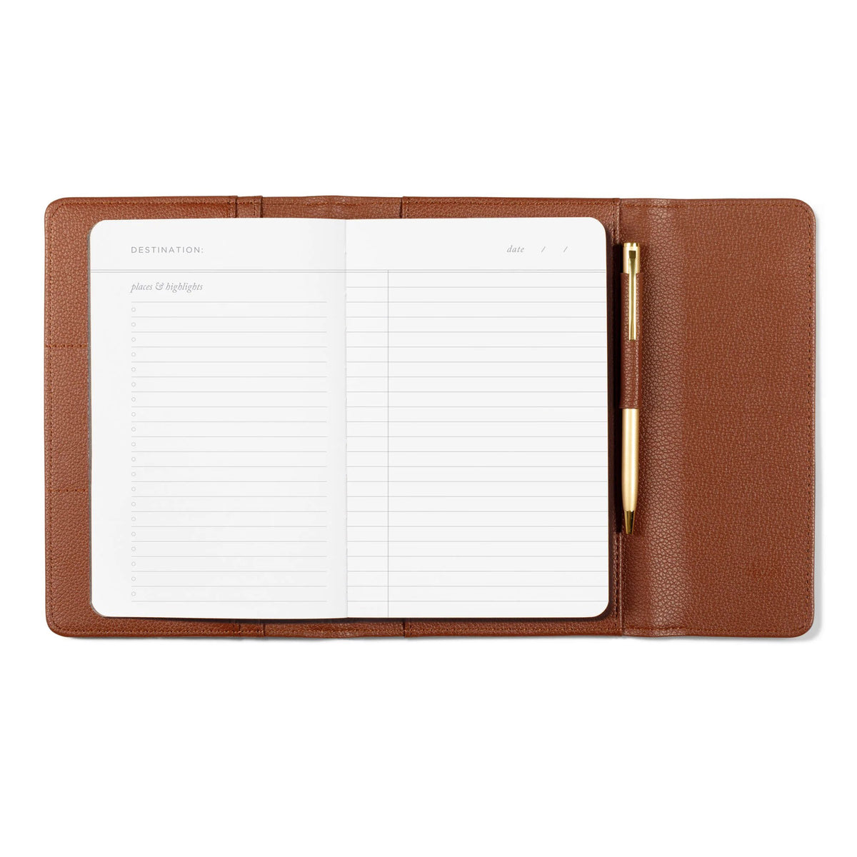 Open brown faux leather Fringe Jet Setter Travel Folio Set containing a lined notebook and a gold pen.