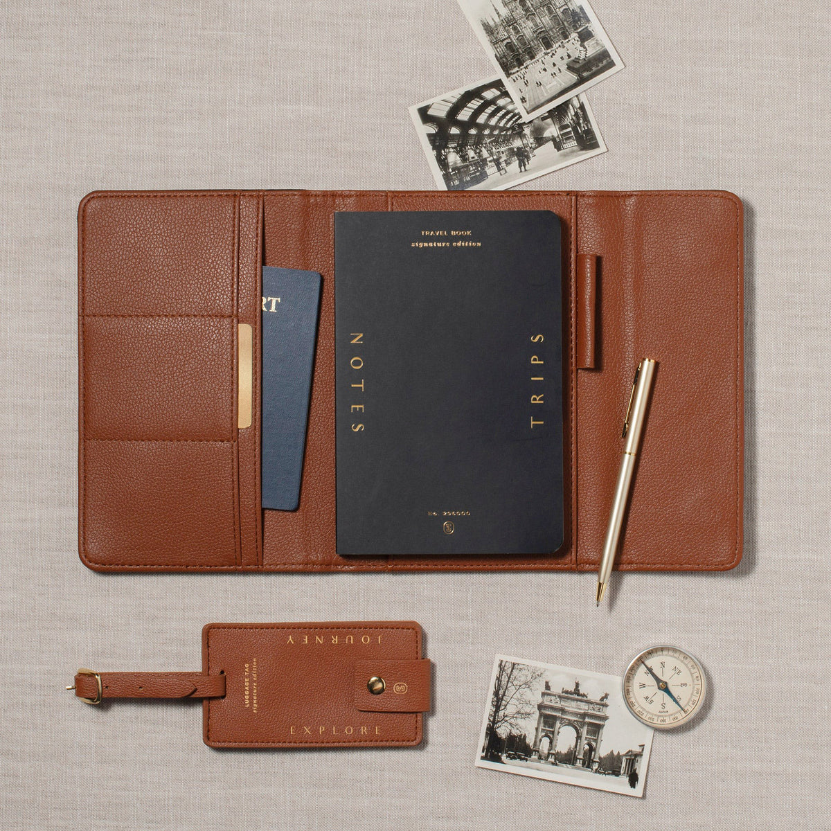 Fringe Jet Setter Travel Folio Set in brown faux leather with a notebook, pen, luggage tag, and vintage photos.