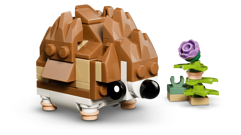 A LEGO® Cute hedgehog with a flower sits by a purple bloom in this exclusive online set.