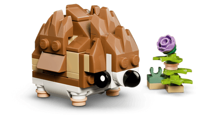 A LEGO® Cute hedgehog with a flower sits by a purple bloom in this exclusive online set.