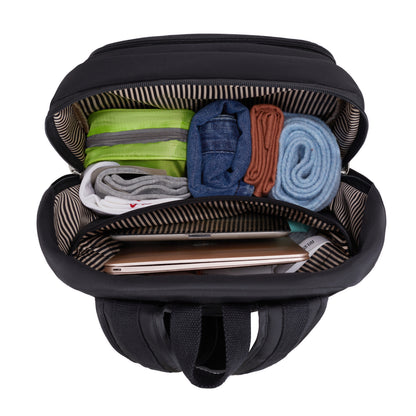 Open Travelon Anti-theft Heritage Backpack with clothes, jeans, towel & laptop neatly packed inside.