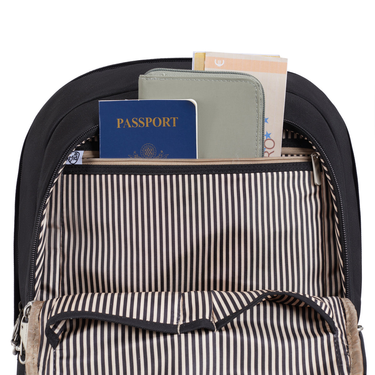 Open Travelon Anti-theft Heritage Backpack to access secured passport/docs in RFID-blocking inner pocket.