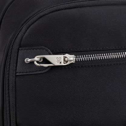 Close-up of a silver zipper on the Travelon Anti-theft Heritage Backpack, highlighting anti-theft details and logo.