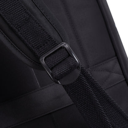 Close-up of Travelon Anti-theft Heritage Backpack’s black strap and buckle, set on black fabric.