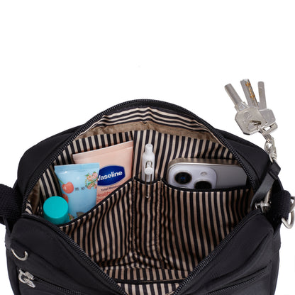 Open Travelon Anti-theft Heritage Crossbody fits keys, phone, sanitizer & more; striped lining inside.