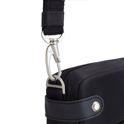 Close-up of a metal clasp connecting a black strap to the Travelon Anti-theft Heritage Crossbody bag.