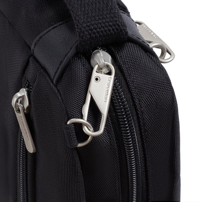Close-up of Travelon Anti-theft Heritage Crossbody zipper pulls, locking clip & side security features.