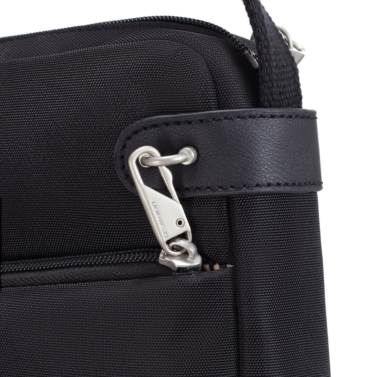 Close-up of Travelon Anti-theft Heritage Crossbody - ONLINE ONLY with black leather trim and security clasp.