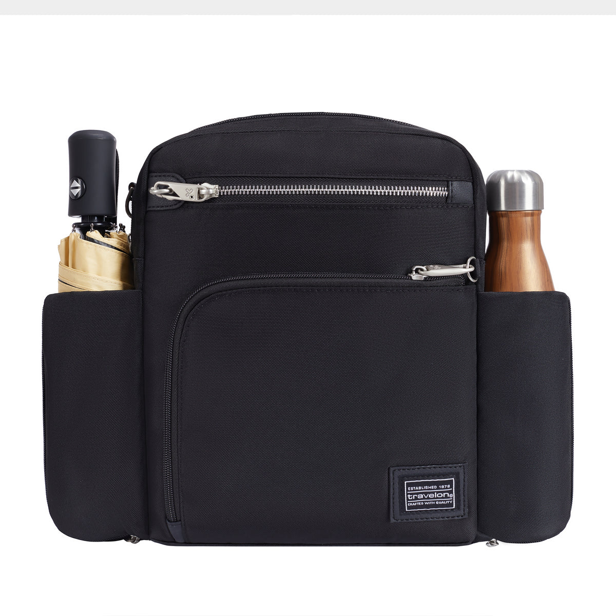 Travelon Anti-theft Heritage Tour Bag holds a beige umbrella and steel bottle in side compartments.
