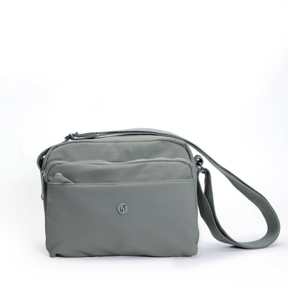 The Miss Caprice Multi-zip Square Crossbody is a gray bag with multiple zippered compartments for daily use.