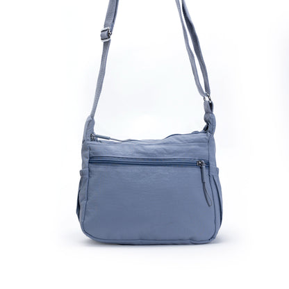 Miss Caprice Multi-zip Small Hobo Crossbody: light blue, adjustable strap, front zipper—ideal for travel.