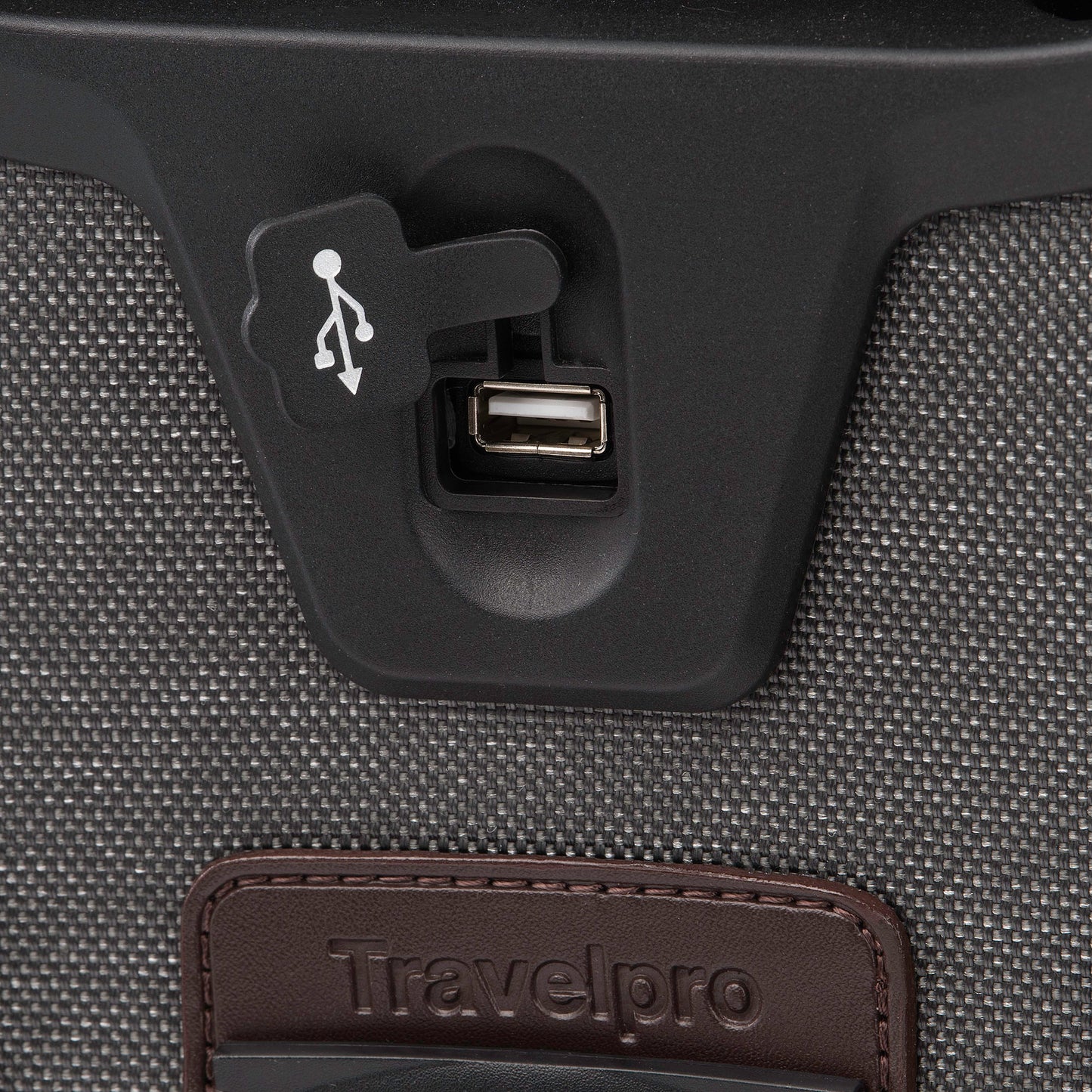 Close up of USB port on the back of the vintage grey Travelpro® Platinum® Elite International Expandable Carry-on Spinner