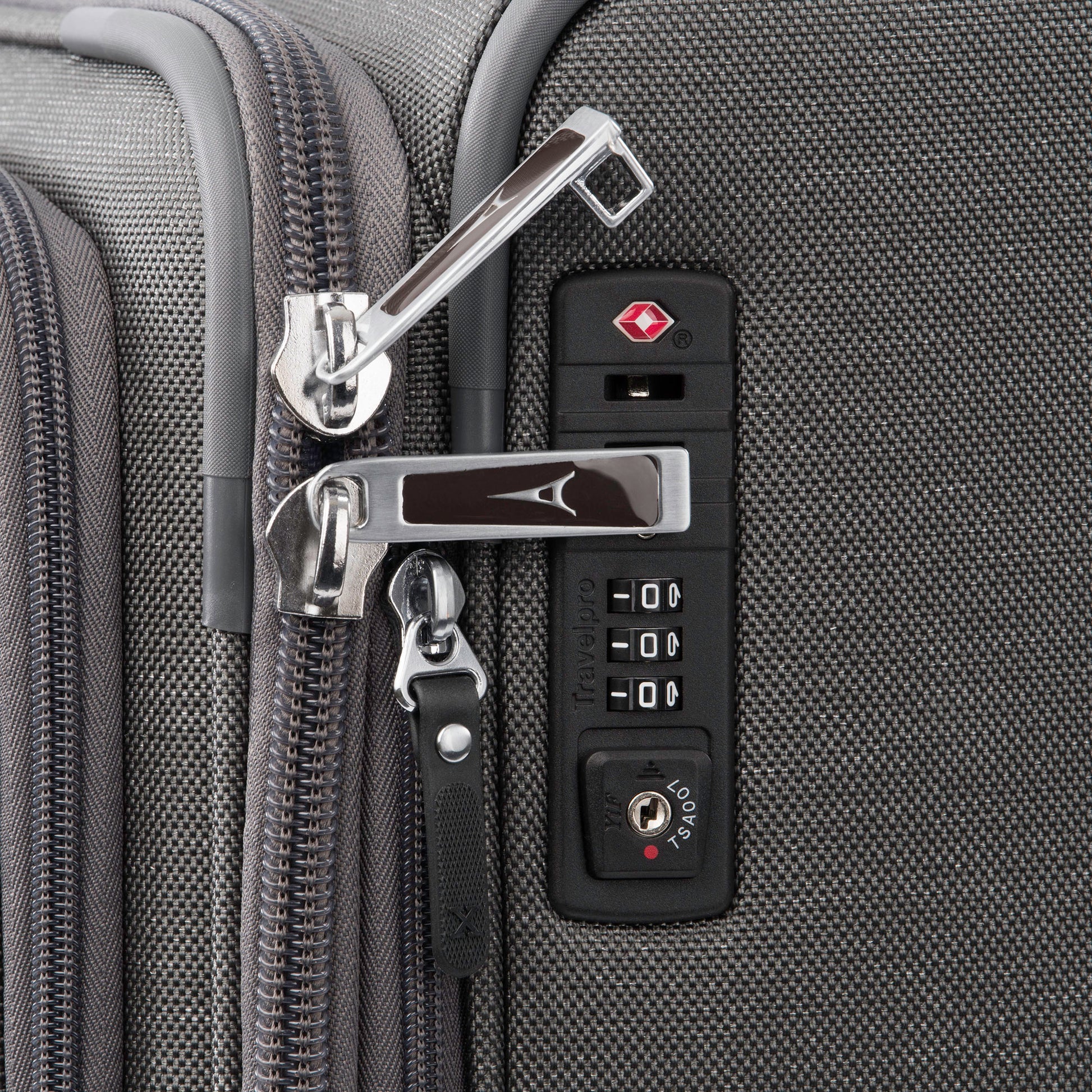 Close up of lockable zipper pulls and TSA lock on side of vintage grey Travelpro® Platinum® Elite 29" Expandable Spinner