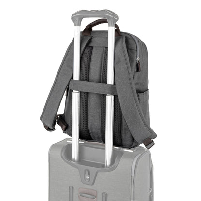 Travelpro® Platinum® Elite Slim Backpack, vintage grey with brown leather details, back angled view with luggage strap around extended telescopic handle of a suitcase