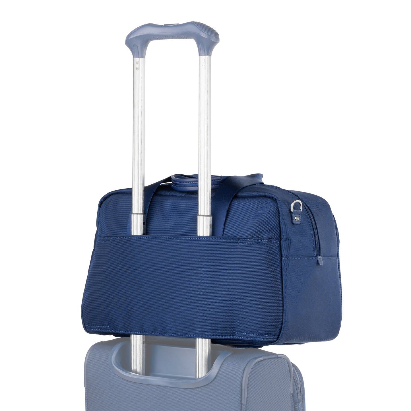 A Travelpro® VersaPack®+ UnderSeat Tote sits atop a light blue suitcase, secured by the handle.