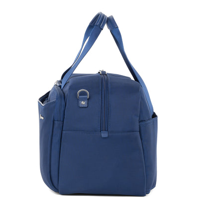 Travelpro® VersaPack®+ UnderSeat Tote in blue with side pockets and dual handles, shown upright on white.