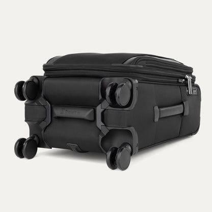 The Travelpro® VersaPack®+ black carry-on spinner, shown flat on its side, features four double wheels.