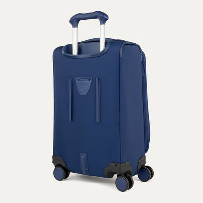 The Travelpro VersaPack+ blue carry-on spinner with TSA lock stands upright against a plain background.
